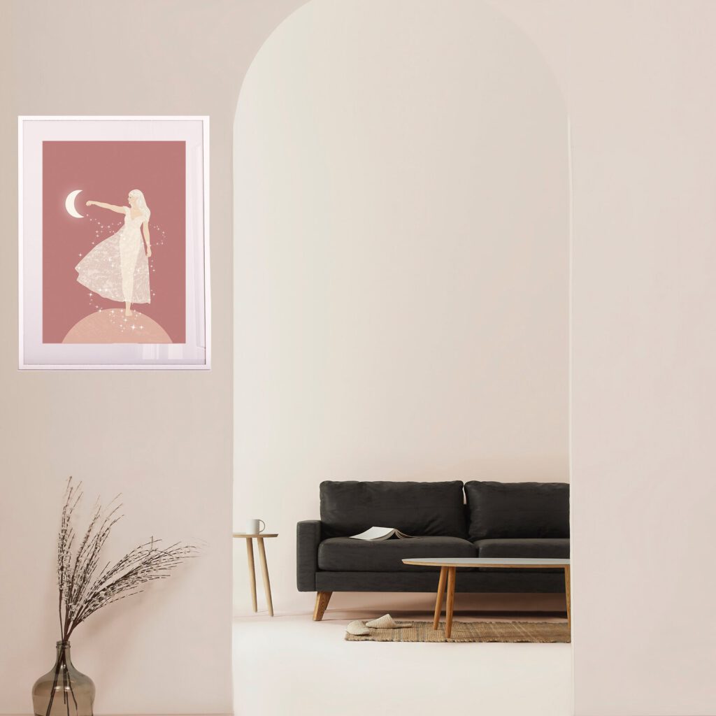 room with an illustration on the left side on the wall with reddish background and a woman pointintg to the moon, in front is a sofa and a table when you walk through a round entry